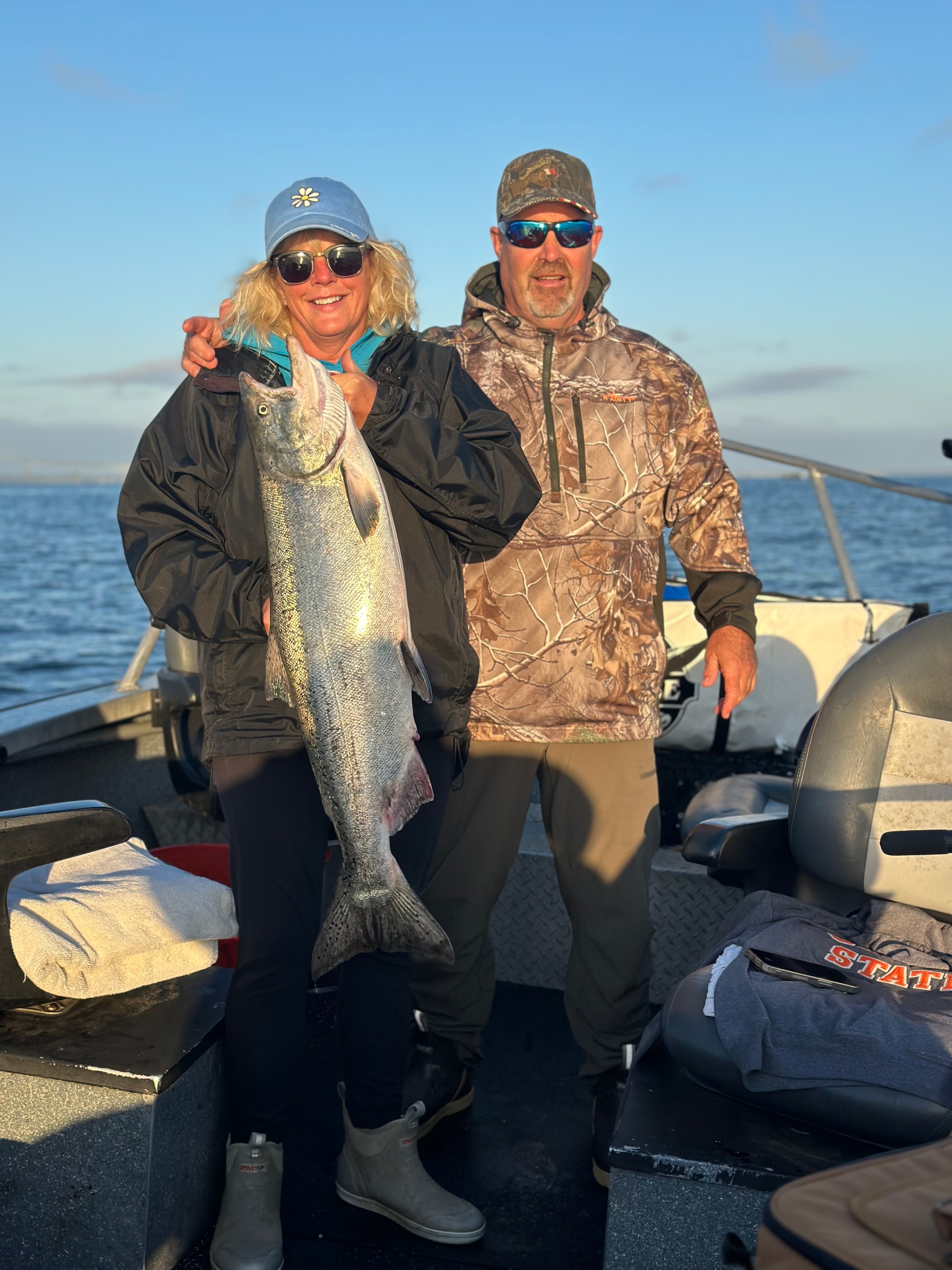 Couple holding large salmon on the Columbia River