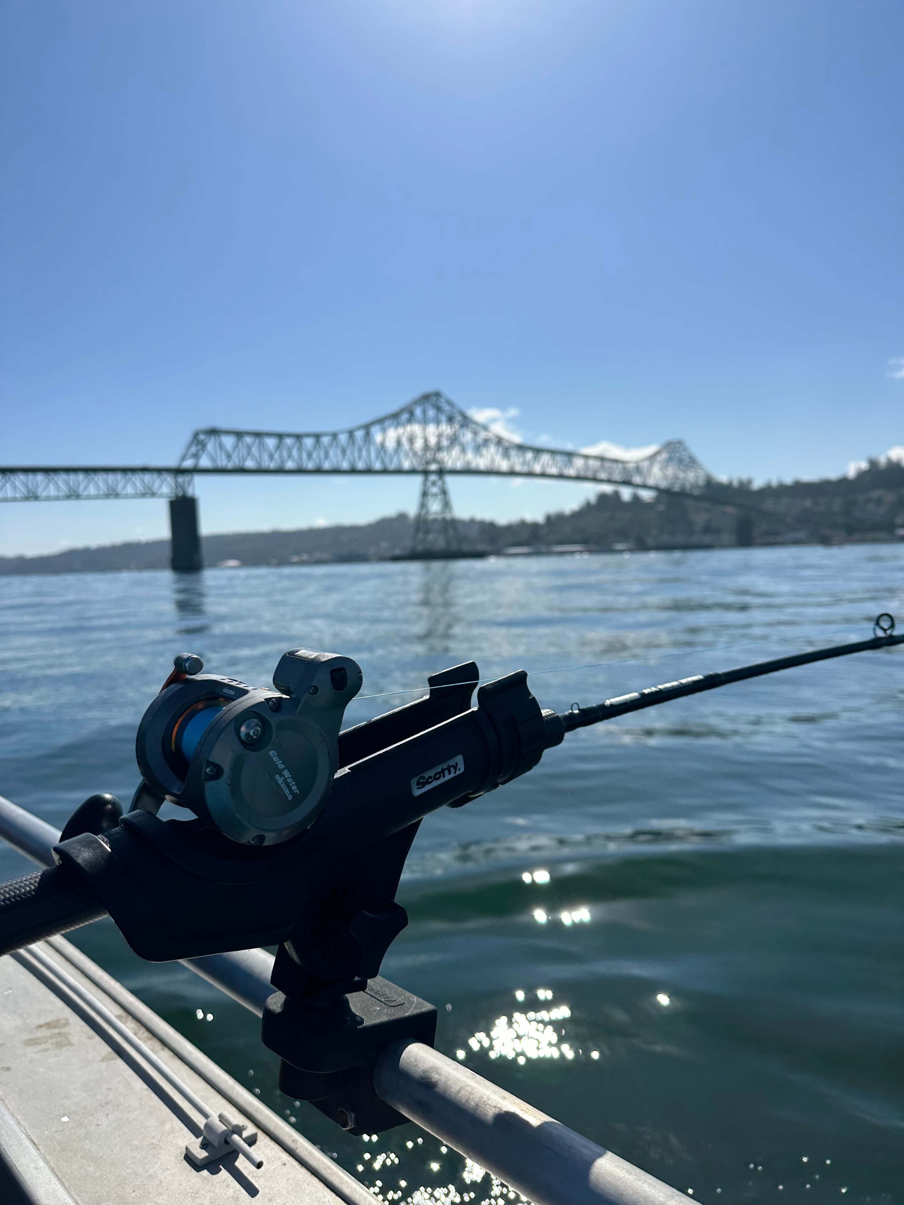 Fishing rod rigged up with the Astoria-Megler Bridge in the background